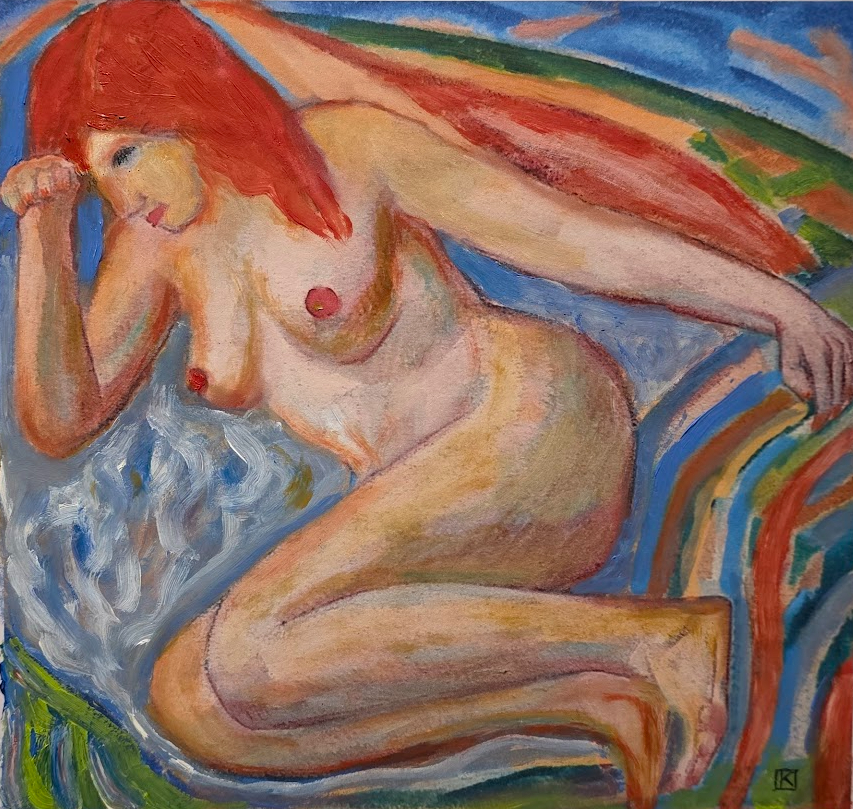 Rousse nue sur un linge de bain 