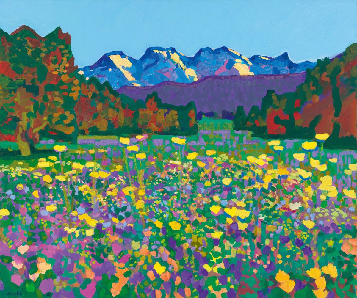 Champ fleuri avec au fond l'Eiger, le Mönch et la Jungfrau